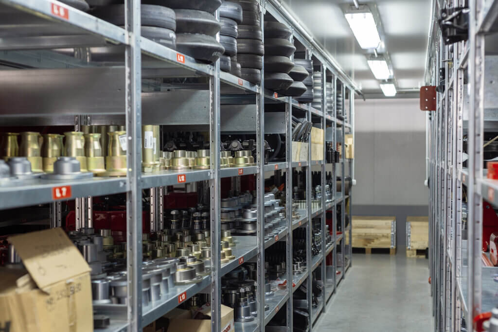 Organized shelves of industrial materials in a factory warehouse