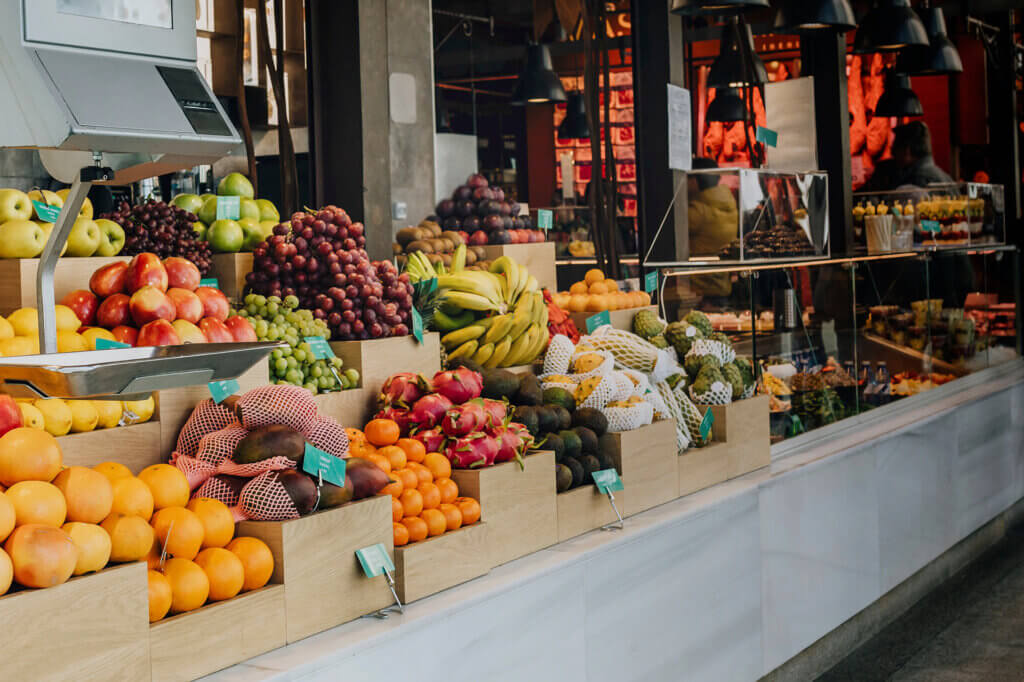 Fresh fruit and produce being displayed at an outdoor market