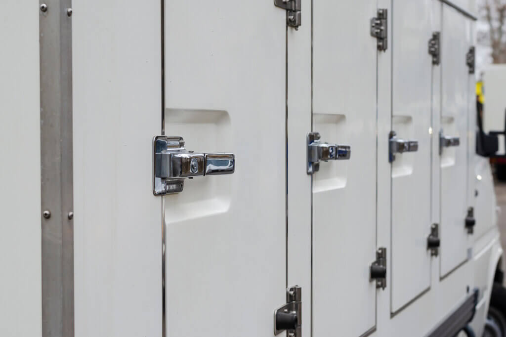 Latched doors on a specialized commercial trailer providing refrigerated delivery services